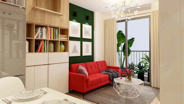 Không gian phòng khách thoáng sáng với điểm nhấn là chiếc ghế sofa màu đỏ - màu sắc tương hợp với chủ nhà mệnh Thổ