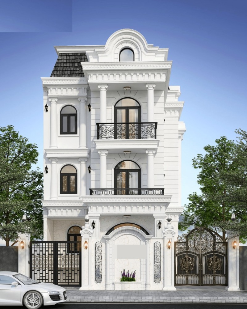 Ngôi nhà 3 tầng có thiết kế phần cột và tường tinh xảo kết hợp với gam màu trắng chủ đạo, hệ cổng và lan can cầu kỳ càng làm tổng thể diện mạo thêm sang trọng, hiện đại