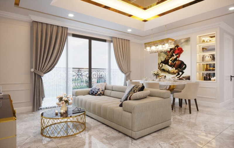 Phòng khách của nhà phố 3 tầng phong cách tân cổ điển mang gam màu trắng - be - nâu nhẹ nhàng và được chấm phá bằng gam màu vàng gold sang trọng