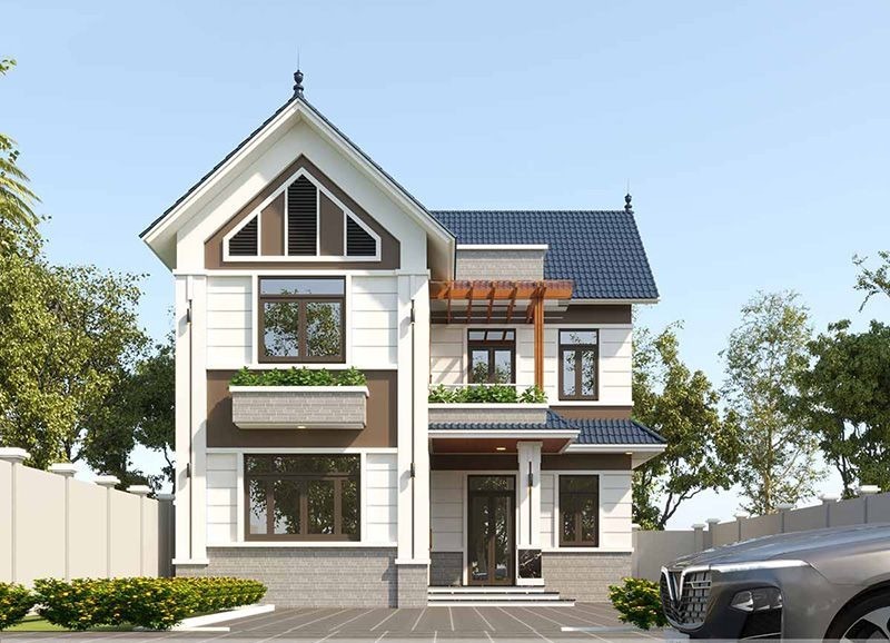 Nhà phố mái Thái 2 tầng chữ L được ốp tường ngoại thất với gam màu trắng - nâu kết hợp với hệ mái màu xanh giúp căn nhà trở nên nổi bật, ấn tượng hơn